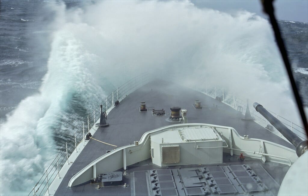 Destroyer HMCS Athabaskan plunges into heavy swells. From Rescue.